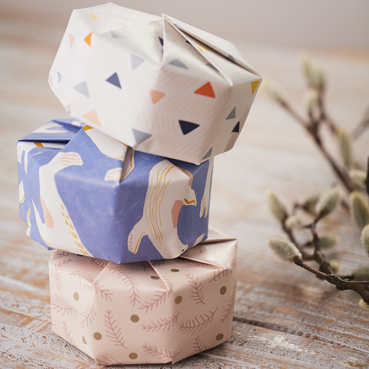 3 piled gifts with Impression Originale recycled and original design gift wraps