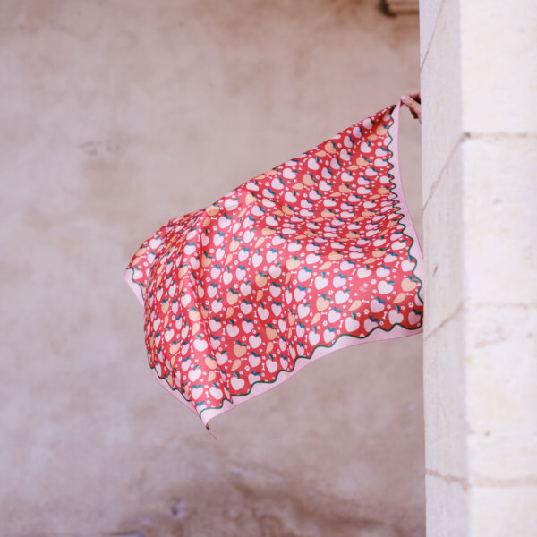 Flying furoshiki with "hearts" design in a historical white stone arch background by Impression Originale